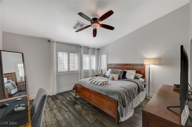 bedroom with ceiling fan, dark wood-type flooring, and lofted ceiling