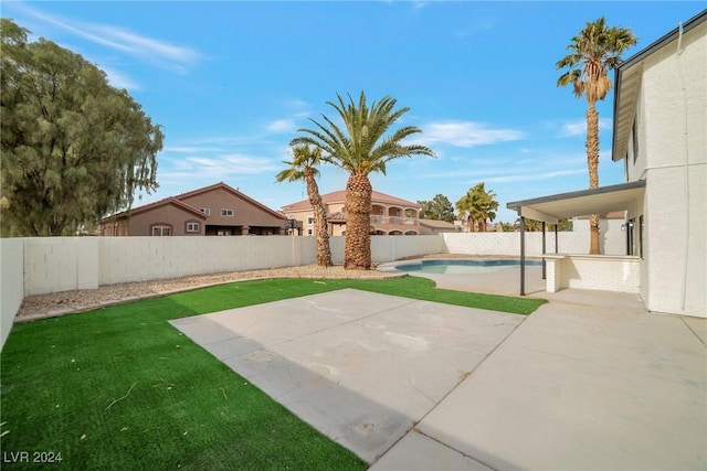 exterior space with a fenced in pool