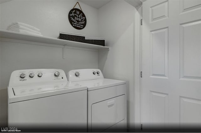 clothes washing area featuring washer and dryer