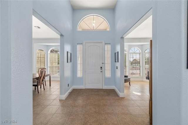 foyer featuring light tile patterned floors