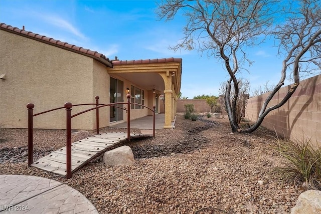 view of home's exterior with a patio