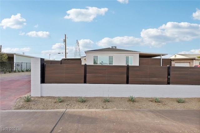 view of side of property with a carport