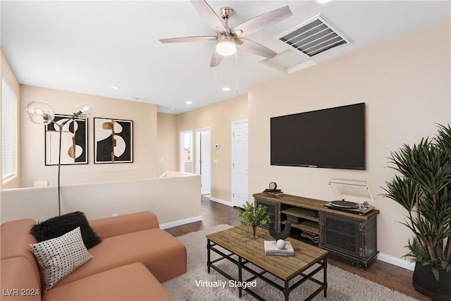 living room featuring dark hardwood / wood-style flooring and ceiling fan