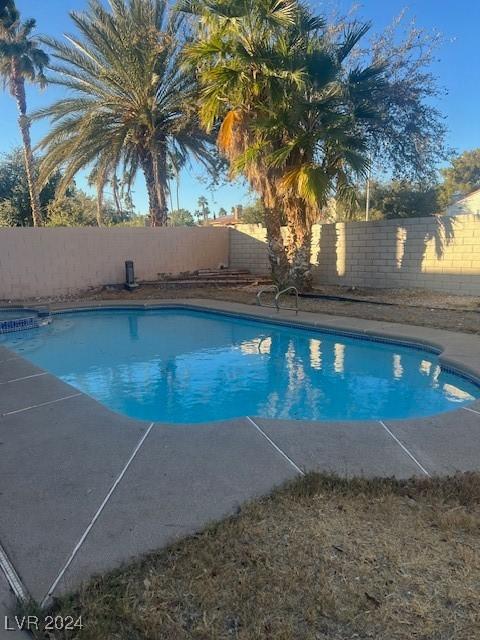 view of pool featuring a fenced in pool and a fenced backyard