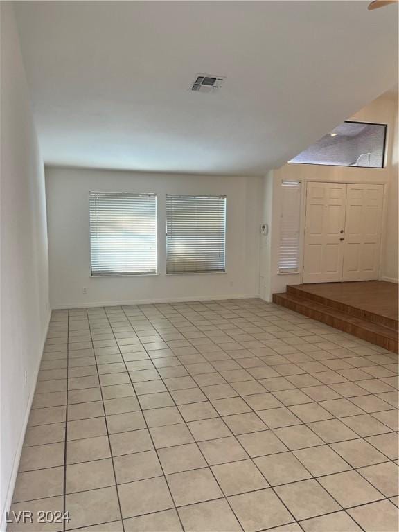 interior space with light tile patterned floors