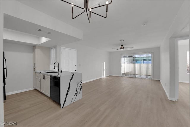 kitchen featuring white cabinetry, dishwasher, sink, and light wood-type flooring