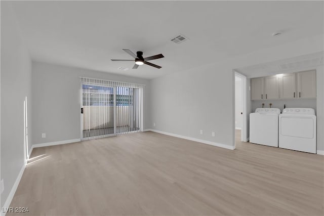 unfurnished living room with independent washer and dryer, light hardwood / wood-style floors, and ceiling fan