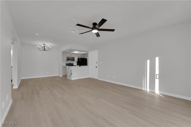 unfurnished living room featuring ceiling fan and light hardwood / wood-style flooring