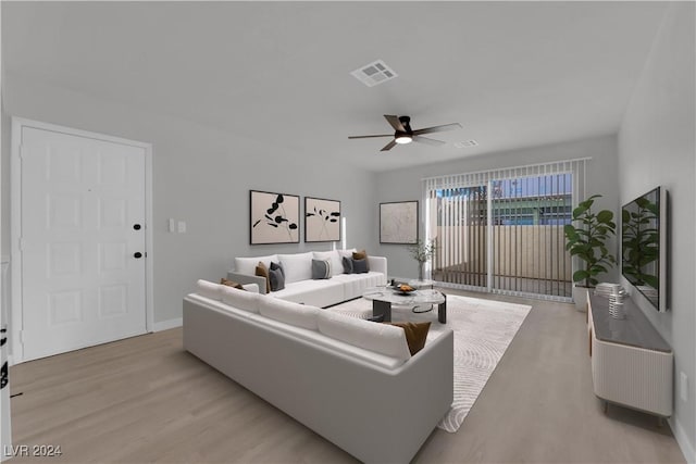 living room featuring ceiling fan and light wood-type flooring