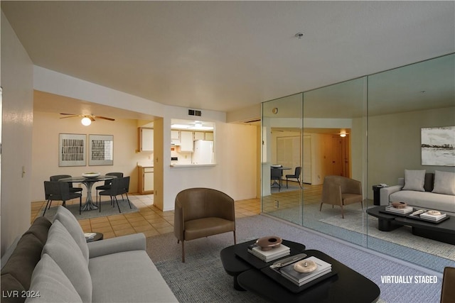 carpeted living room with ceiling fan