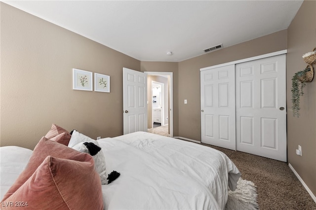 carpeted bedroom with a closet