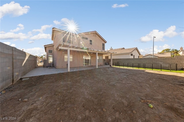 back of house with a patio area