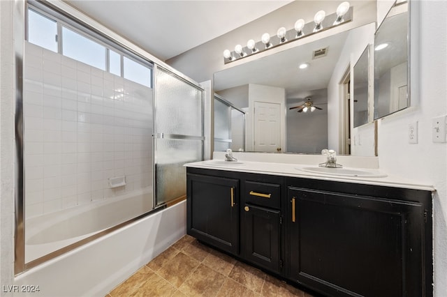 bathroom featuring shower / bath combination with glass door, ceiling fan, and vanity