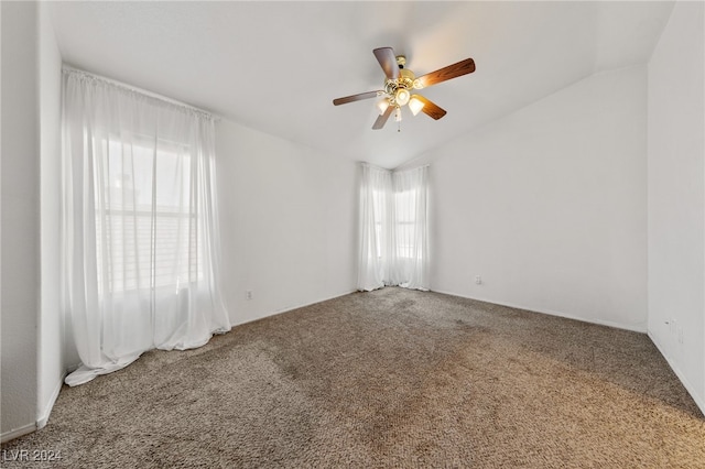 unfurnished room with carpet, ceiling fan, and vaulted ceiling