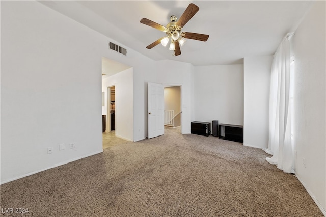 interior space with light colored carpet and ceiling fan