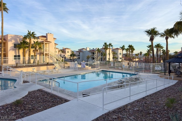 view of swimming pool featuring a gazebo and a patio area