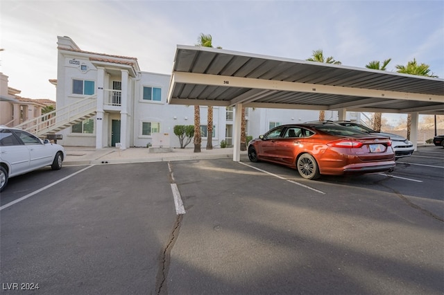 view of parking / parking lot featuring a carport