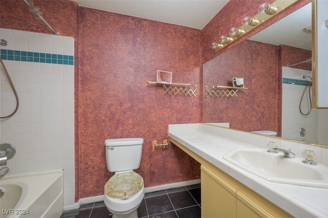 full bathroom featuring tile patterned floors, vanity, toilet, and tiled shower / bath