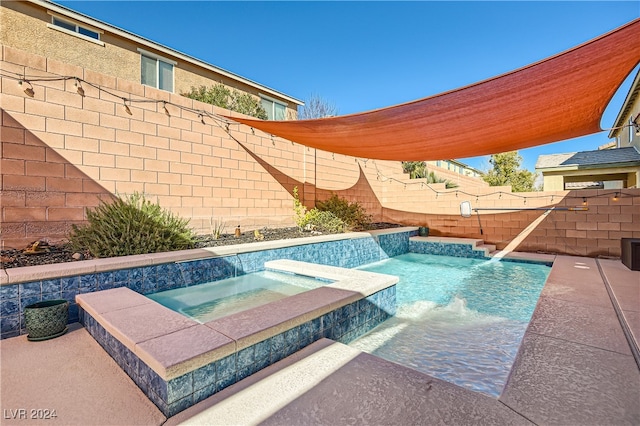 view of swimming pool with an in ground hot tub and pool water feature