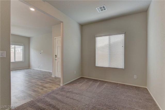 spare room with light hardwood / wood-style flooring