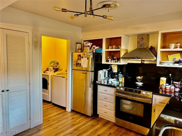 kitchen featuring wall chimney exhaust hood, stainless steel appliances, separate washer and dryer, light hardwood / wood-style floors, and white cabinets