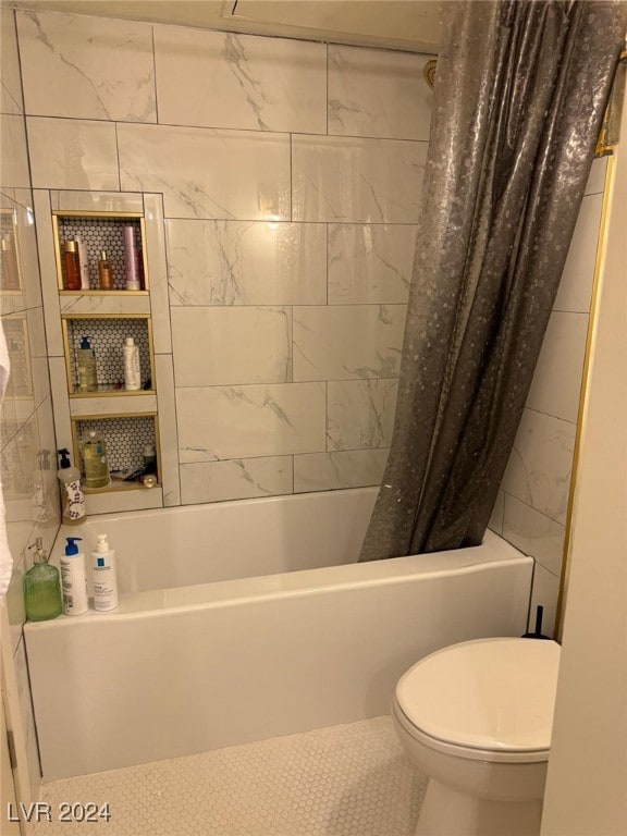 bathroom featuring tile patterned floors, shower / tub combo with curtain, tile walls, and toilet