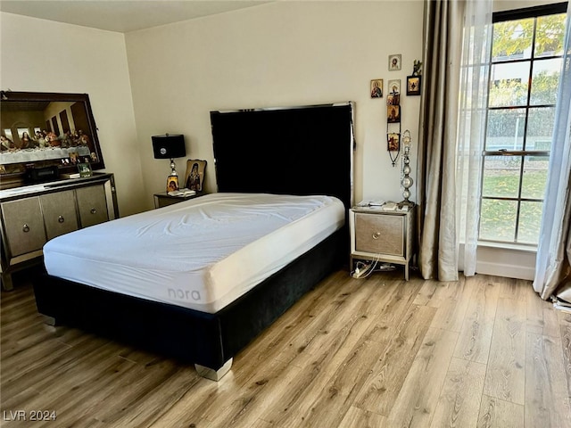 bedroom with light wood-type flooring