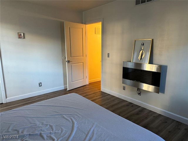 bedroom featuring dark wood-type flooring