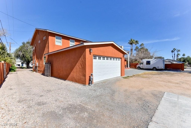 view of side of property with a garage