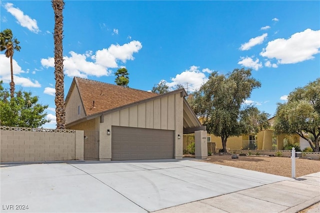 view of side of property featuring a garage