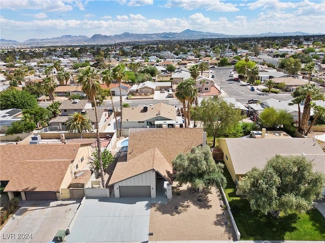 birds eye view of property with a mountain view