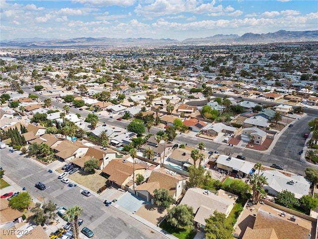 birds eye view of property with a mountain view