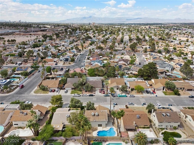 birds eye view of property featuring a mountain view