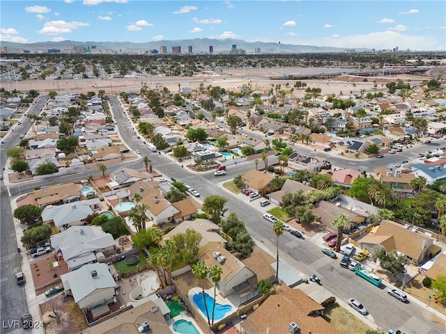 birds eye view of property featuring a mountain view