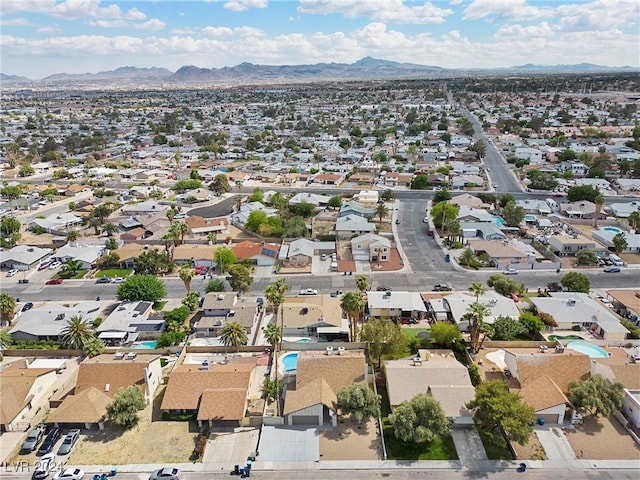 birds eye view of property with a mountain view