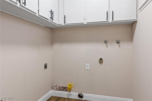 laundry area with cabinets, washer hookup, dark wood-type flooring, and electric dryer hookup