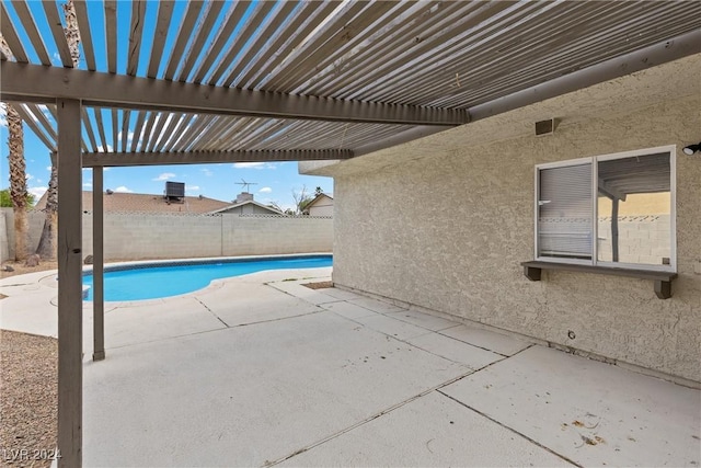 view of swimming pool featuring central AC unit, a patio area, and a pergola