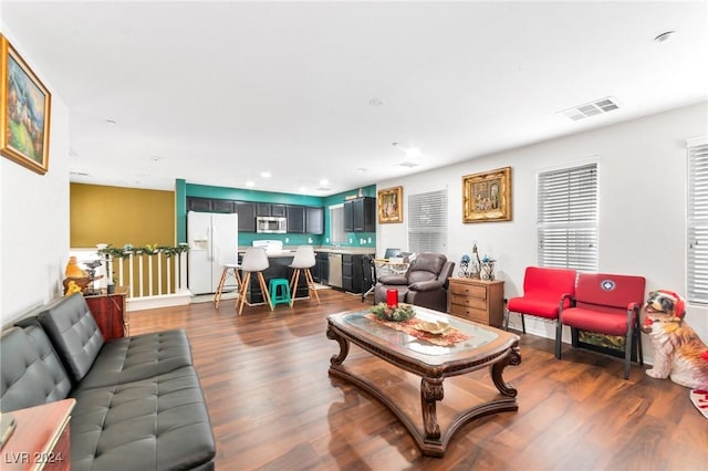 living room featuring dark wood-type flooring