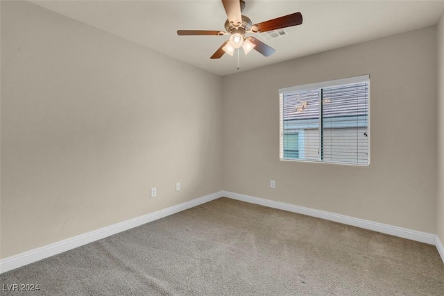 carpeted empty room with ceiling fan