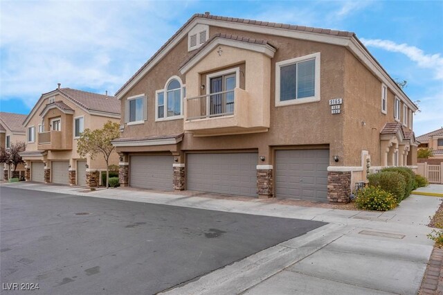 multi unit property featuring a garage