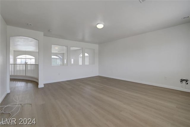 unfurnished room with light wood-type flooring