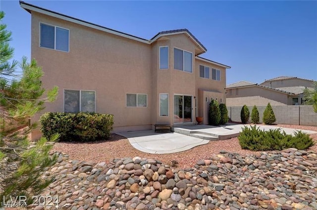 rear view of property with a patio area