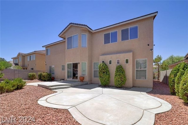 rear view of house with a patio