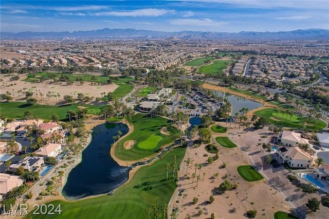 birds eye view of property featuring a water and mountain view