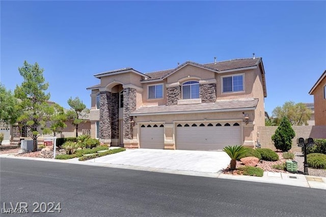 view of front of property with a garage