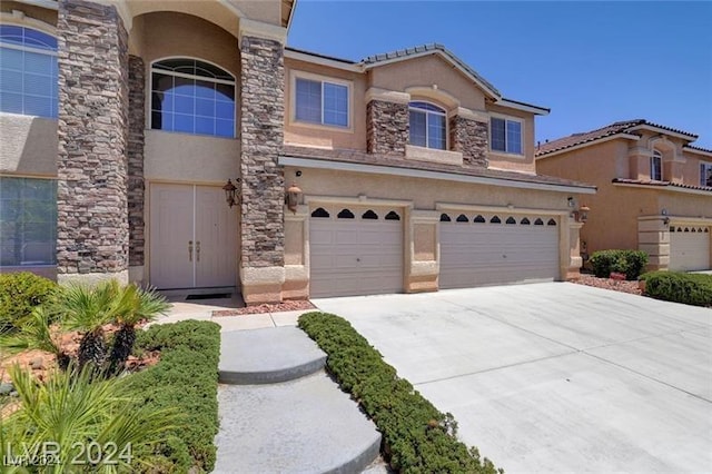 view of front of home with a garage