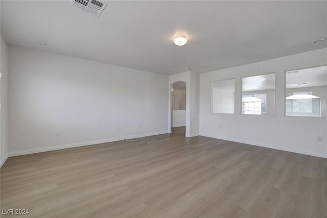 unfurnished room featuring light hardwood / wood-style floors