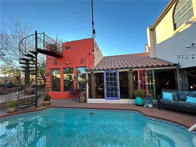 view of swimming pool featuring a patio