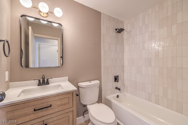 full bathroom featuring vanity, tiled shower / bath combo, and toilet