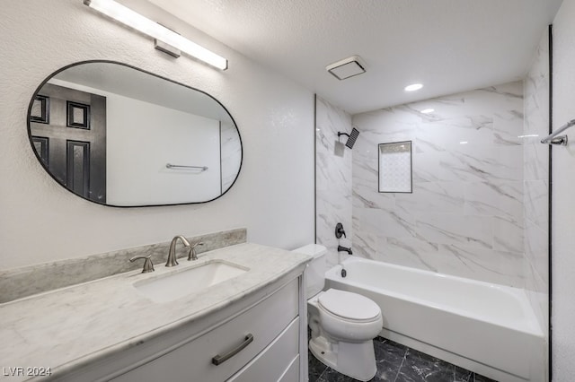 full bathroom with tiled shower / bath combo, toilet, a textured ceiling, and vanity